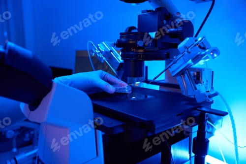 Preview: Lab scientist preparing for cell manipulation with micromanipulator