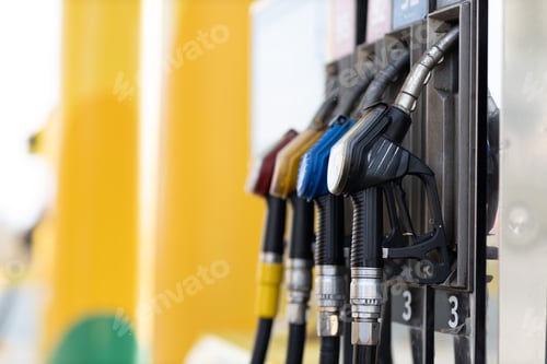Preview: Filling pistol in his hand at gas station