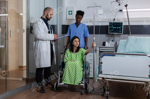 Preview: Therapist medic writing disease recovery on clipboard in hospital ward