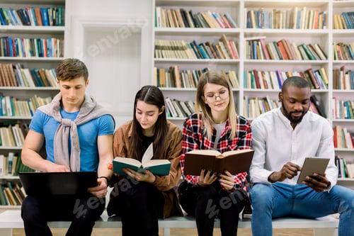 Preview: Technology, computers, ebooks and traditional print books in education. Team of multiethnic students