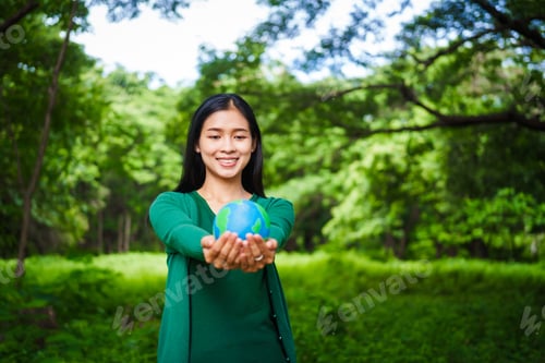 Preview: A male hand holds a hammer, symbolizing the enforcement of tree conservation laws. This highlights