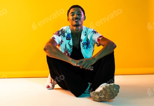 Preview: African man portrait in studio on colorful background