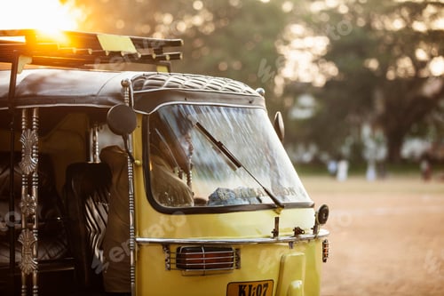 Preview: Evening hues reflecting on an auto rickshaw's journey