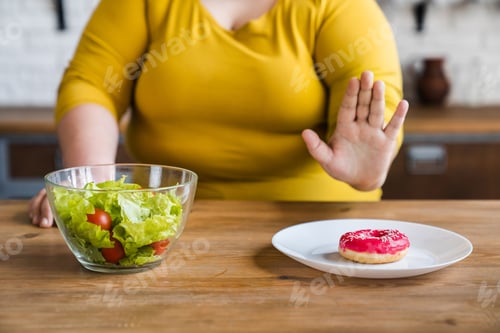 Preview: Pensive fat chubby obese caucasian woman opting for healthy food instead of sweets.