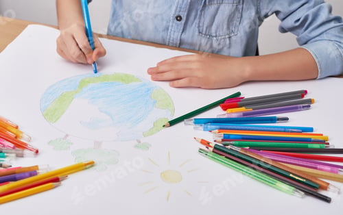 Preview: Child boy draws planet for earth day. Protection of enviroment, Mother Earth Day. Save our planet