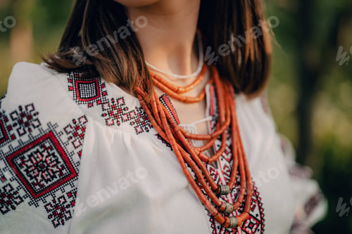 Preview: Ukrainian woman in embroidery vyshyvanka dress and ancient coral beads. Traditional antique jewelry