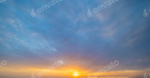 Preview: Sunset sky. Abstract nature background. Dramatic blue and orange, colorful clouds at twilight time.