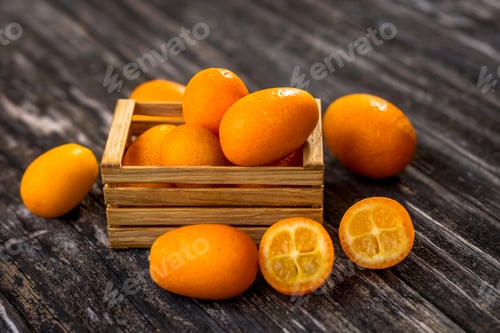 Preview: Raw Organic Kumquats on wooden background