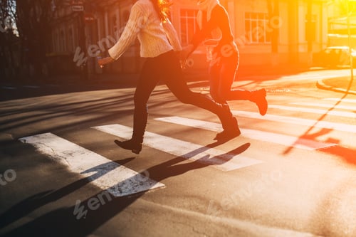 Preview: Abstract concept of couple crossing street