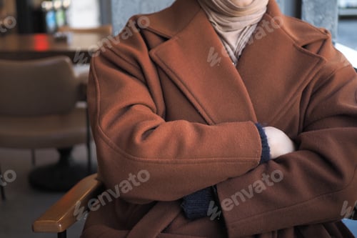 Preview: thoughtful muslim women sitting on cafe