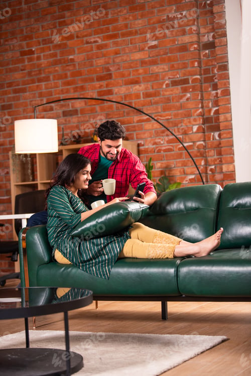 Preview: Indian asian smart and young couple using smartphone for call of for social media