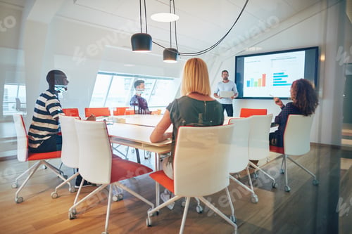 Preview: Staff asking their manager questions during an office presentation