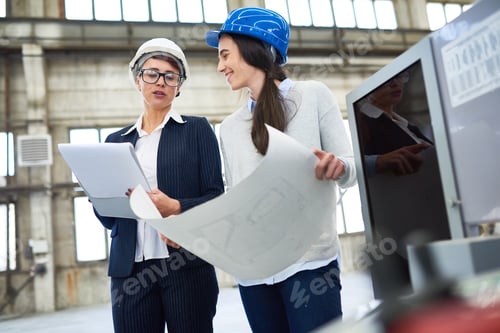 Preview: Positive female engineers discussing plan