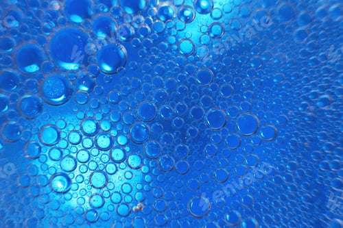 Preview: abstract light blue background with oil circles . bubbles of water close up .