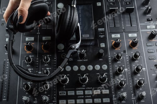 Preview: DJ playing music at mixer closeup
