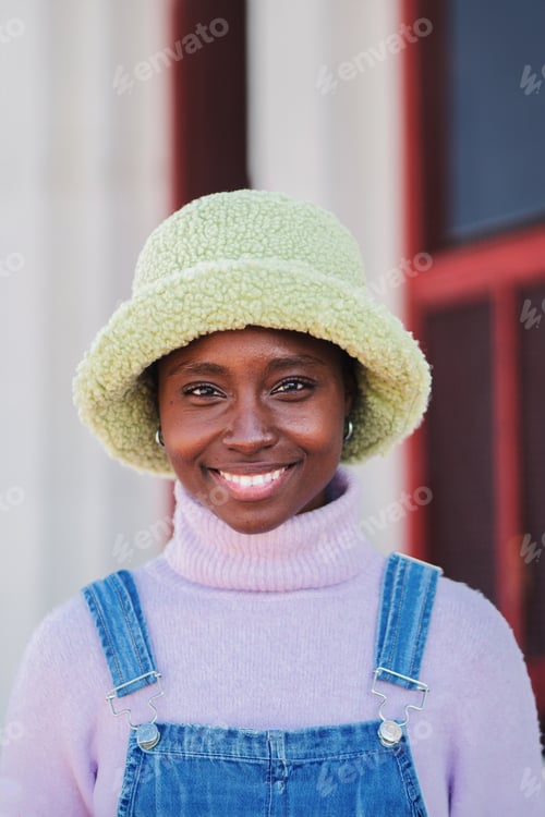Preview: Vertical close up portrait of happy beautiful african american young woman looking at camera. Front
