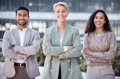 Preview: Shot of a diverse group of businesspeople standing together in the city with their arms folded