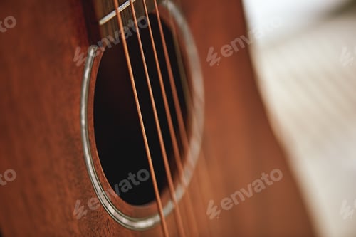 Preview: Get to know your instrument. Close up photo of acoustic guitar sound hole