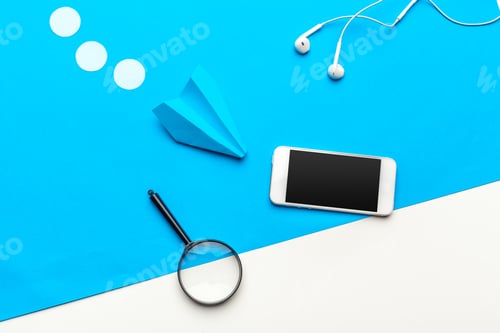Preview: paper plane with office supplies on blue background