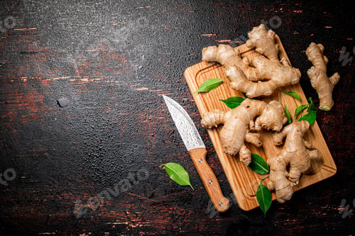 Preview: Ginger on a cutting board with a knife.