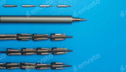 Preview: a set of the screwdriver and bits on the table. simple abstract flat lay