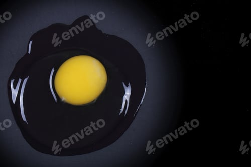Preview: Chicken Egg Lies Broken On The Black Desk