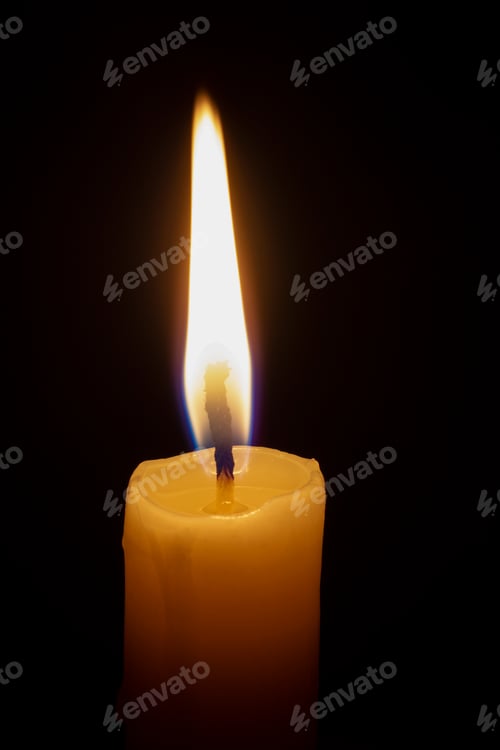 Preview: a lonely burning candle in the darkness