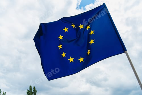 Preview: low angle view of european union flag waving against sky
