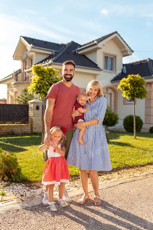 Preview: Parents and children standing in front of their new house