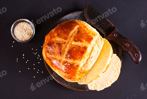 Preview: fresh bread on black table