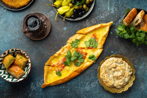 Preview: Pide - Turkish pizza made of dough with minced meat, vegetables and melted cheese topping