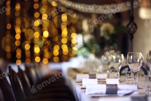 Preview: Formal wedding place setting on long table background