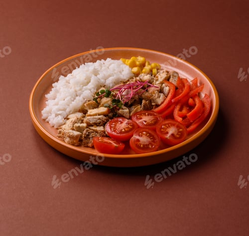 Preview: Bowl with chicken pieces, rice, tomatoes, peppers and microgreens. Bowl with chicken