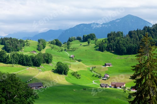 Preview: Panoramic view of countryside, green alpine meadows and mountains