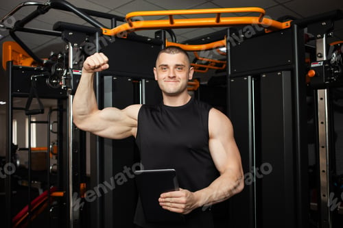 Preview: young handsome coach with a muscular body