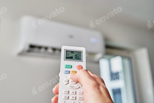 Preview: Hand adjusting temperature on air conditioner