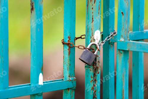 Preview: Old rusty fence or gate with chained padlock