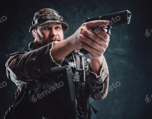 Preview: Armed with modern handgun guy in camouflage equipment