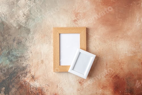 Preview: Close up view of small and big colorful photo frames hanging on pastel colors wall with free space