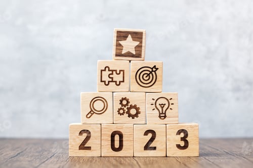 Preview: 2023 wood block with mission, action, objective, teamwork, plan, idea and New Year start concept