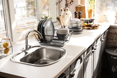 Preview: Stylish kitchen with sink and clean dishware