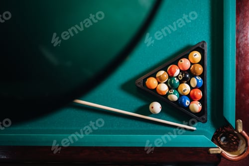 Preview: Billiard table with green surface and balls in the billiard club.Pool Game