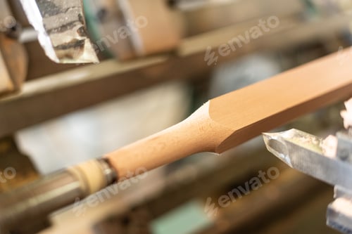 Preview: Wooden baluster lathe, unfocused background, shaped. Carpentry