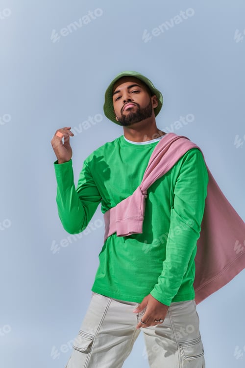 Preview: handsome african american male model in trendy street outfit dancing on camera, fashion concept