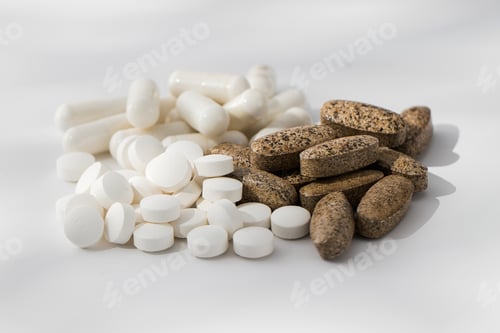 Preview: A variety of pills and vitamins in a pile on a white background. Medicine, medicines.