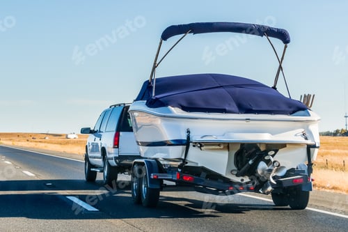 Preview: Truck towing a boat on the interstate, California