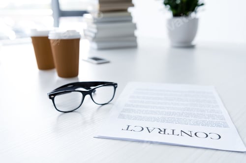 Preview: composition with eyeglasses and business documents on white desk