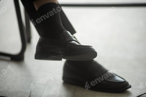 Preview: closeup on black leather shoes of businessman, modern business concept