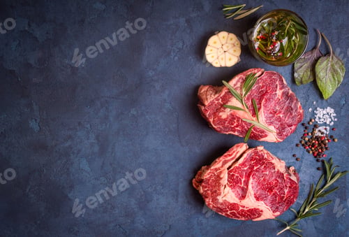 Preview: Raw meat steak on rustic concrete background ready to roasting