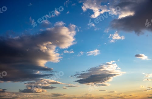 Preview: Sunrise, sunset few clouds on blue sky background. Copy space.